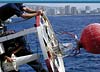 Coast Guard Seamen Repairing a 9X35LWR Buoy